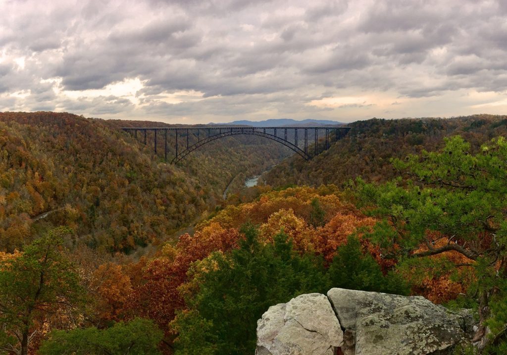 Autumn view of the New River Gorge Bridge from the Long Point Trail near Fayetteville - a great place for leaf peeping. 