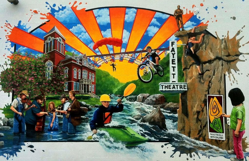 The first exterior mural in Fayetteville is a composite of all the fun activities Fayetteville and the New River Gorge have to offer.