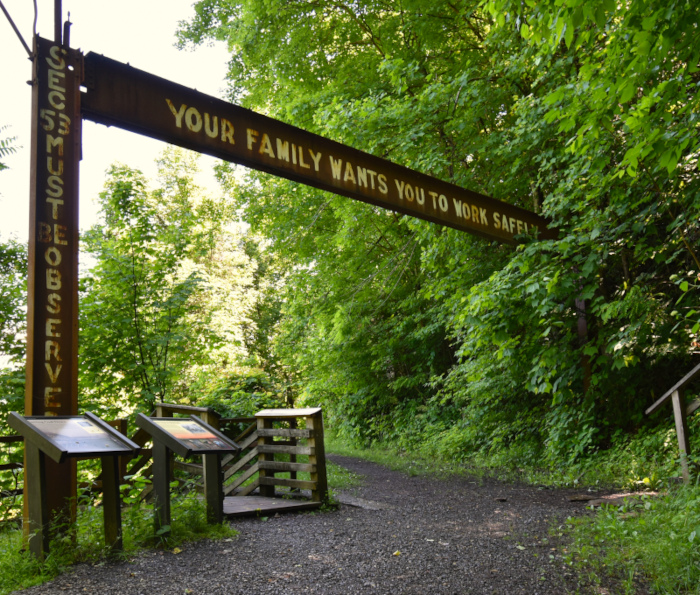 A sign for to miners reading, "Your family wants you to work safely" still stands along the Kaymoor Trail in the New River Gorge National Park. 