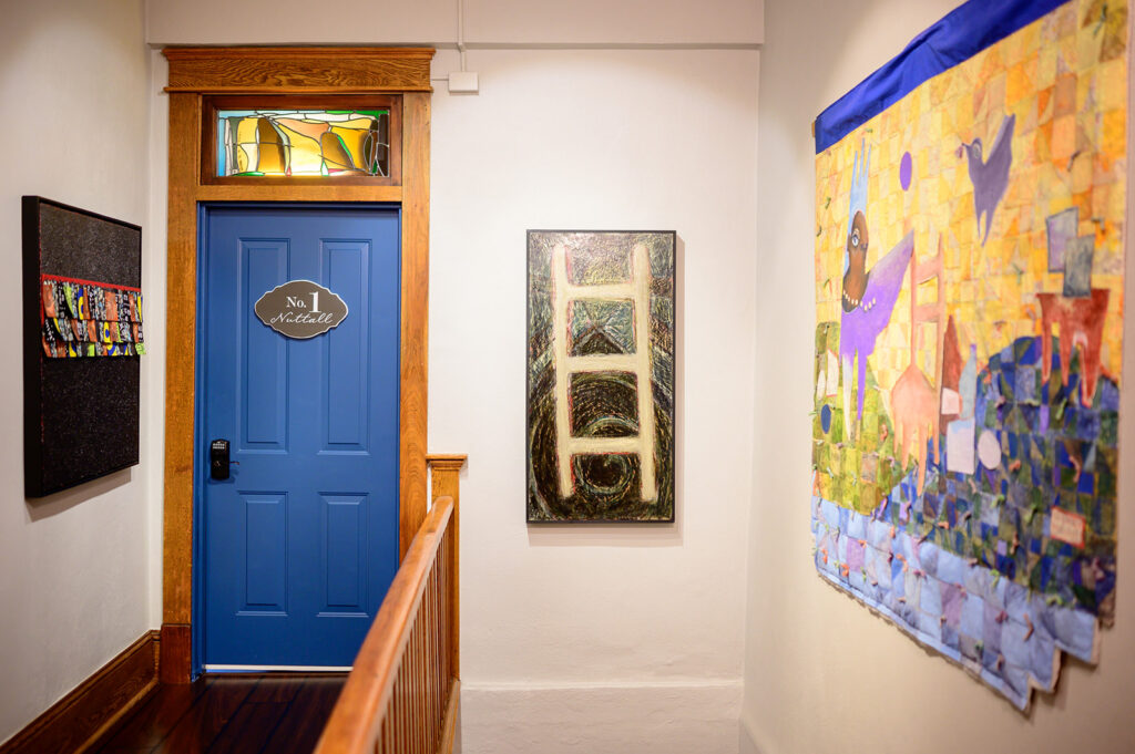 The second floor of Lafayette Flats with art by West Virginia artists covering the walls. 