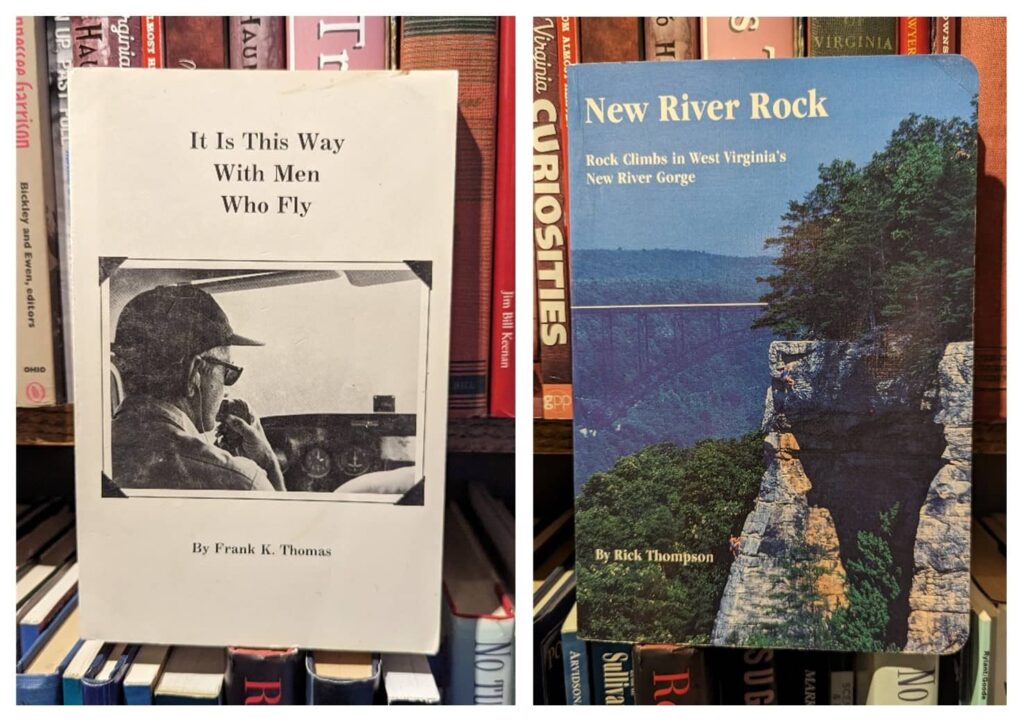 A white paperback book entitled, "It is This Way With Men Who Fly" and a blue paperback book entitled, "New River Rock" sitting on Lafayette Flats' bookshelf.
